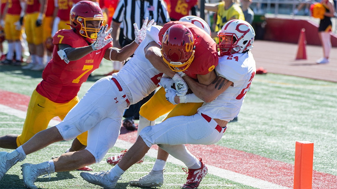 Senior Joe McNally forces his way into the endzone.